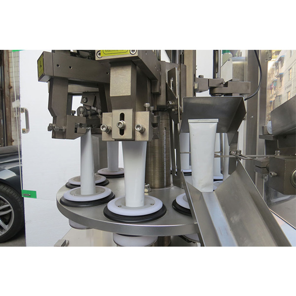 Aŭtomata ultrasona medicina kaj farmacia tubo pleniganta sigelilon